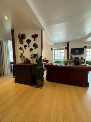 a large living room with a couch and a table at The Bear Apartments in Llandovery