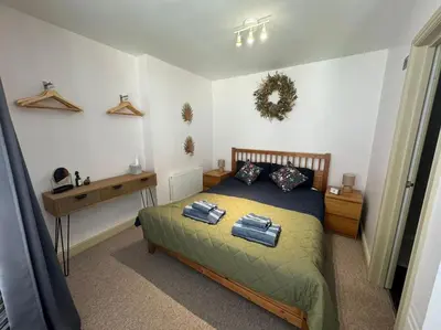 a bedroom with a bed and a desk in it at The Nook Castle Street Ludlow in Ludlow