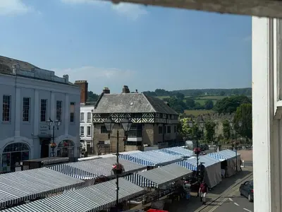 a view of a street with blue and white umbrellas at The Nook Castle Street Ludlow in Ludlow