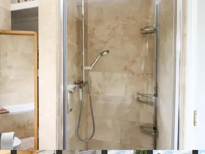 a shower with a glass door in a bathroom at Trevonnen in Llyswen