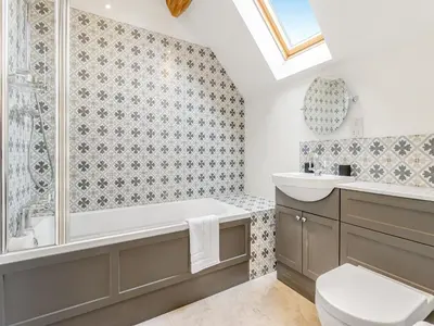 a bathroom with a tub and a toilet and a sink at Orchard Barns - Uk47200 in Stapleton