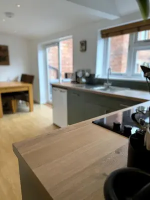 a kitchen with a counter top and a stove top at Penny Black Apartment, Kington in Kington