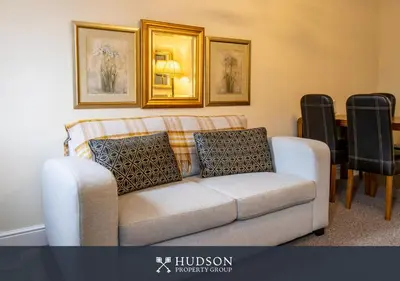 a living room with a couch and a table at 2 Bed Shrewsbury Apartment in Great Location in Shrewsbury