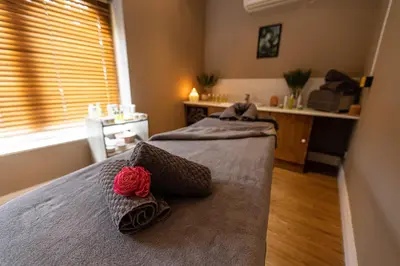 a bedroom with a bed with two pillows on it at Albrighton Hall Hotel and Spa, a member of Radisson Individuals in Shrewsbury