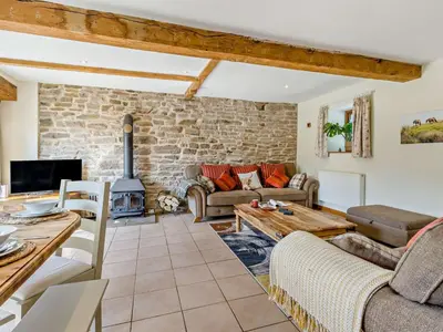 a living room with a couch and a table at 5 Bed in Craven Arms oc-95212 in Tugford