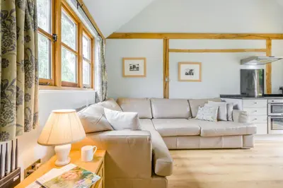 a living room with a couch and a table at 2 Bed in Little Hereford oc-l29580 in Berrington