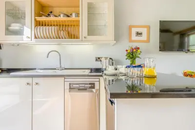 a kitchen with white cabinets and a sink at 2 Bed in Little Hereford oc-l29580 in Berrington