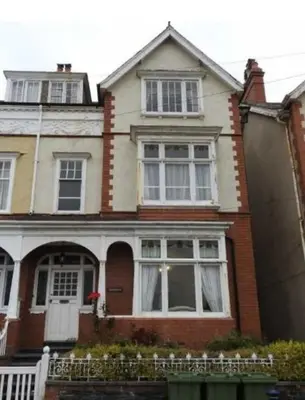 a house with a white door and windows at Abergwaun Apt 2 in Aberystwyth