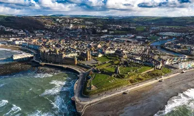 an aerial view of a city next to the ocean at Abergwaun Apt 3 in Aberystwyth