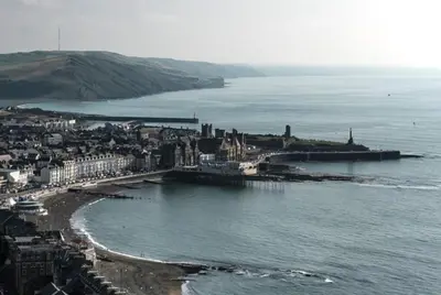 an aerial view of a city next to the ocean at Abergwaun Apt 3 in Aberystwyth