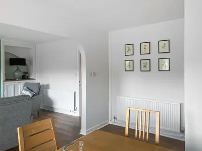 a living room with a couch and a table at Mum's Place in Hay-on-Wye