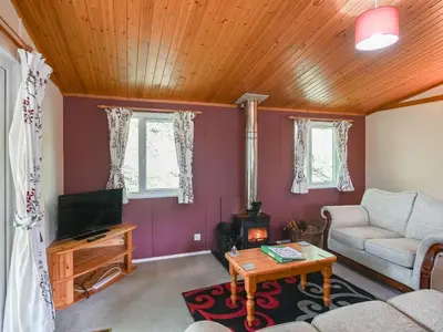 a living room with a couch and a tv at The Squirrels Drey C32 - Uk45927 in Newtown
