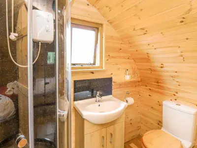 a bathroom with a sink and a toilet at Oak View in Llangadog