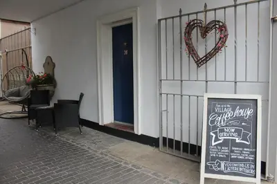 a sign on the side of a building with a heart sign at Shrewsbury Georgian town house - Hills Lane in Shrewsbury