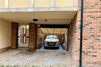 a car is parked inside of a garage at The Stokesay Ludlow in Ludlow