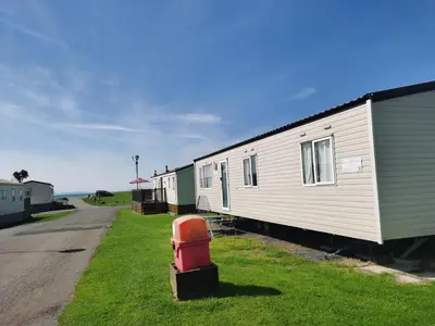 a row of mobile homes on the side of a road at Snowdonia Holiday Sea Beach and Mountains view in Llwyngwril