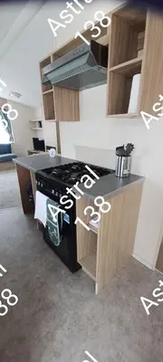 a kitchen with a stove and a counter top at Astral 138 snowdon summit 098 in Barmouth