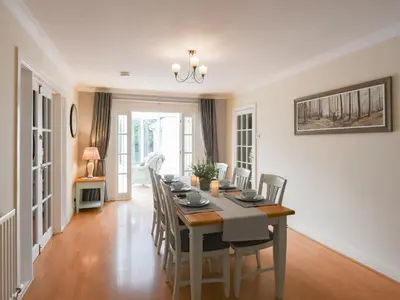 a dining room with a table and chairs at The Bungalow in Castle Caereinion