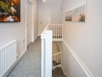 a staircase in a home with white walls and carpet at 2 bedroom home within walking distance of the town - Pass the Keys in Shrewsbury