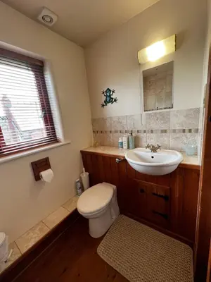 a bathroom with a toilet and a sink at Frog Cottage, Ludlow - a charming townhouse for 4 in Ludlow