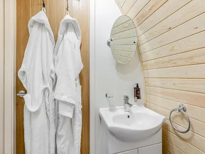 a bathroom with a sink and a white towel at Leri - Uk46065 in Llancynfelyn