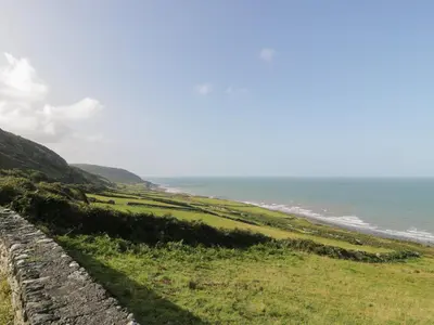 a view of the ocean from a rock wall at Dysynni Pod in Tywyn