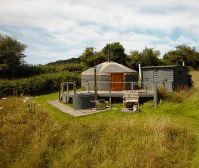 a yurt in the middle of a field at Go Eco Glamping in Lampeter