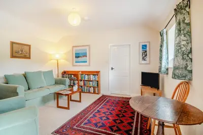 a living room with a couch and a table at 1 Bed in Hay-on-Wye oc-c29788 in Hay-on-Wye