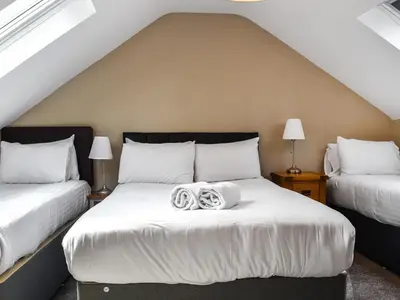 a bedroom with two beds with white sheets at Cottage 1- Uk47770 in Llanilar