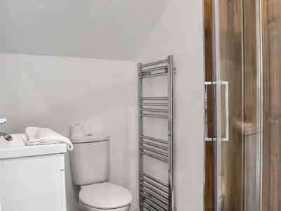 a white bathroom with a toilet and a shower at Cottage 1- Uk47770 in Llanilar