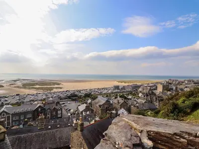 a view of a coastal town with a beach at Pengarreg in Barmouth