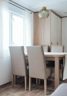 a dining room with a table and chairs at Foxglove Lodge in New Quay