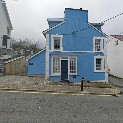 a blue house on the side of a street at 3 Bed in New Quay oc-c29640 in New Quay