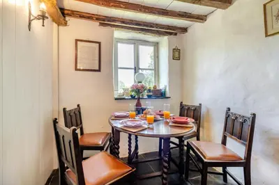 a dining room with a table and chairs at 3 Bed in Llwynygroes oc-t29715 in Llangeitho