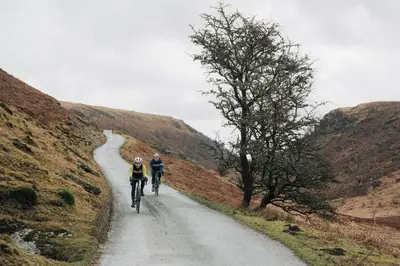 two people riding bikes down a dirt road at 1 Bed in Llwynygroes oc-y29714 in Llangeitho