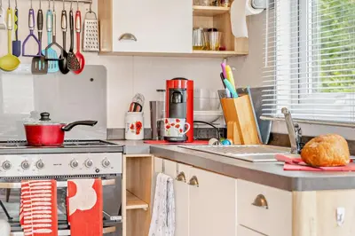 a kitchen with a stove and a counter top at 2 Bed in Gilfachrheda oc-o29754 in Llanina