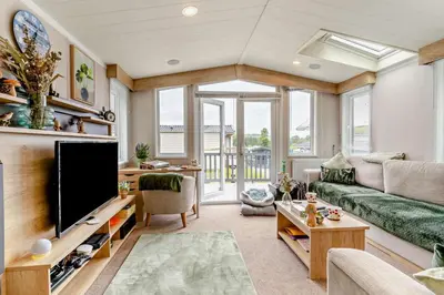 a living room with a large flat screen tv at 2 Bed in Gilfachrheda oc-o29754 in Llanina