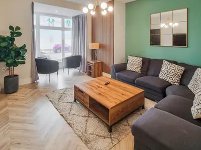 a living room with a couch and a coffee table at Uk47852 - No 1B in Aberystwyth