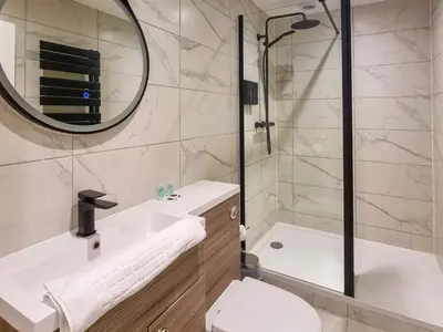 a bathroom with a sink and a toilet and a mirror at Uk47852 - No 1B in Aberystwyth