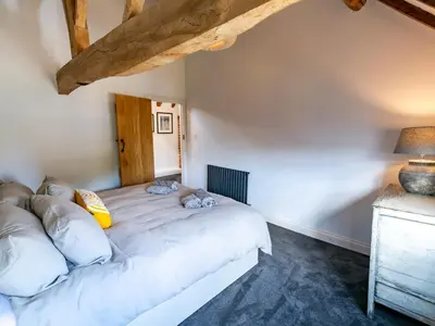 a bedroom with a large bed in a room at Countryside home 5 minutes from Ludlow - Pass the Keys in Ludlow