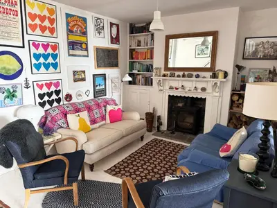 a living room with a couch and a fireplace at Morwylfa Borth and Ynyslas in Borth