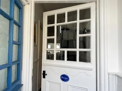 a white door with a clear glass window at Morwylfa Borth and Ynyslas in Borth