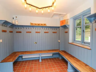 a sauna with a bench in a room at Llwynderw Hall in Llanwrtyd Wells