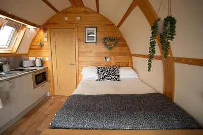 a bedroom with a bed in a tiny house at Aberystwyth by Wigwam Holidays in Aberystwyth