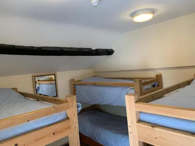 two bunk beds in a cabin on a boat at River Wye Hostel in Hereford