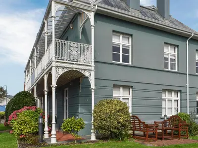 a blue house with a balcony on it at Uk47786 - Flat 4E in Aberystwyth
