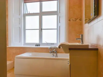 a bathroom with a sink and a window at Uk47786 - Flat 4E in Aberystwyth