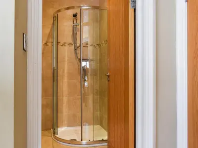 a shower with a glass door in a bathroom at Uk47786 - Flat 4E in Aberystwyth