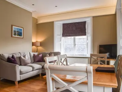 a living room with a couch and a table at Uk47786 - Flat 4E in Aberystwyth