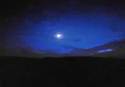 a night sky with the moon in the sky at Owl Cabin in Llanbrynmair